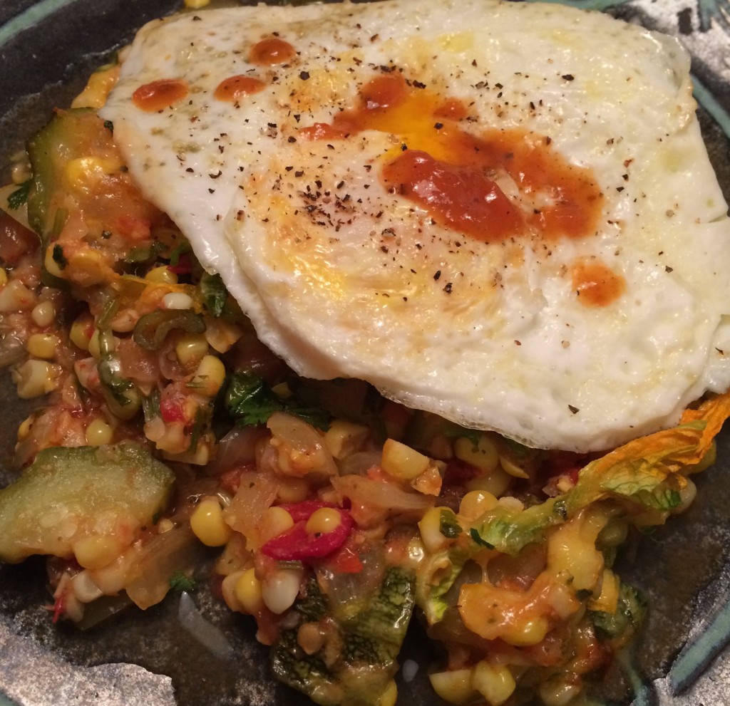 Calabacitas makes a complete meal topped with a fried egg